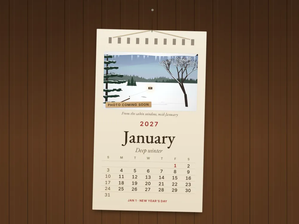 The Muskoka Calendar 2027, January page: a snowy lake view drawn from the cabin window above the month grid (sample page)
