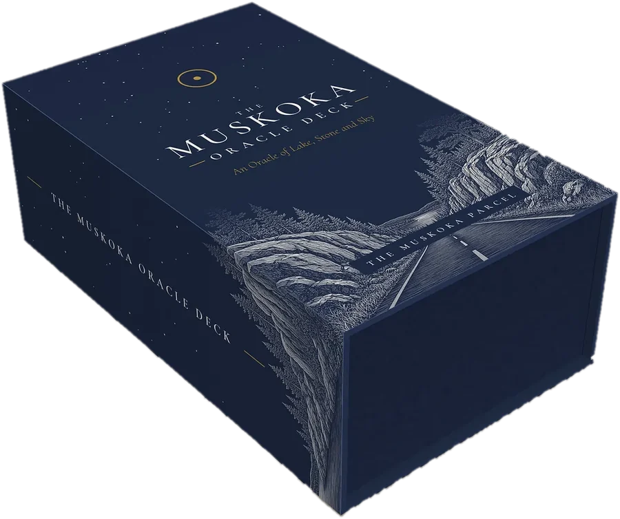 The Muskoka Oracle Deck box: full navy, with an engraved night road through the rock cuts on the lid